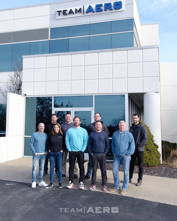 Image featuring Team Aero employees outside the Team Aero building